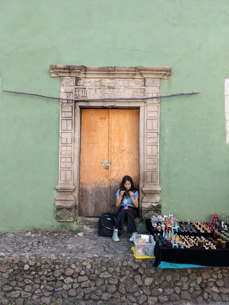 Artisan market seller selling souveneers and traditional artesanal products at Malinalco Market, Malinalco, Mexico