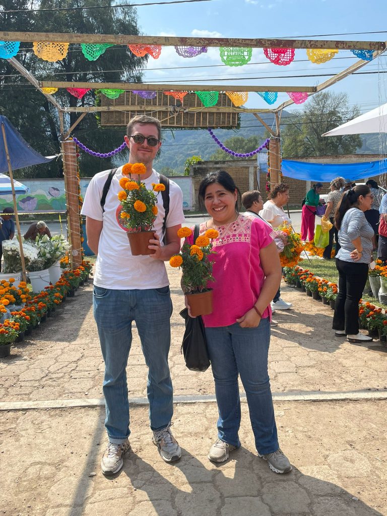 Two people in a cemetery during Day of the Dead in Cuernavaca Mexico