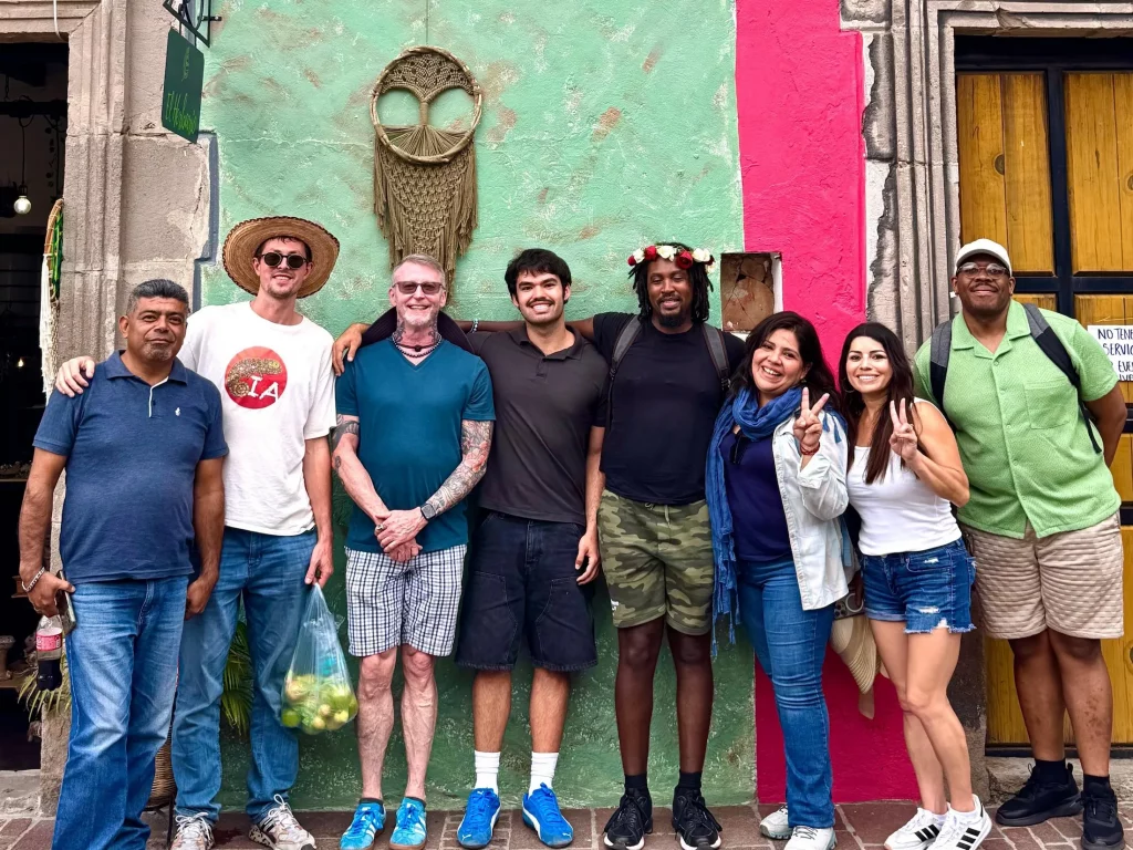 Iguana Abroad Spanish immersion students posing in front of colorful colonial houses in the historical centre of Malinalco, Mexico