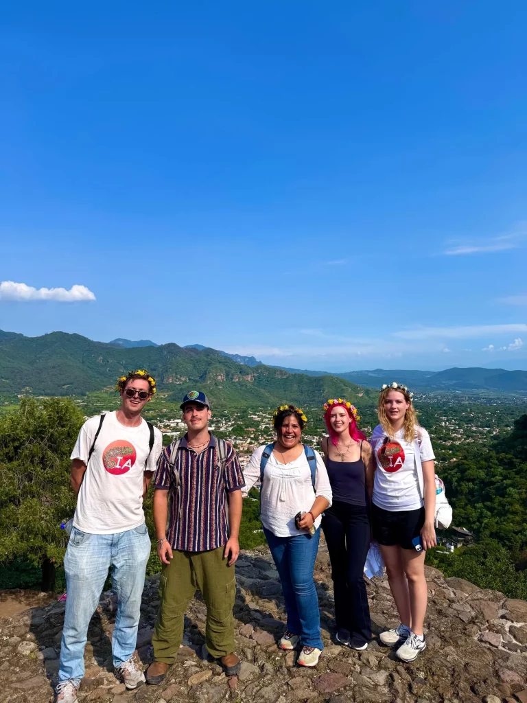 Iguana Abroad Spanish immersion students posing on top of the Cuauhcalli Pyramid in the Archeological Zone of Malinalco, Mexico