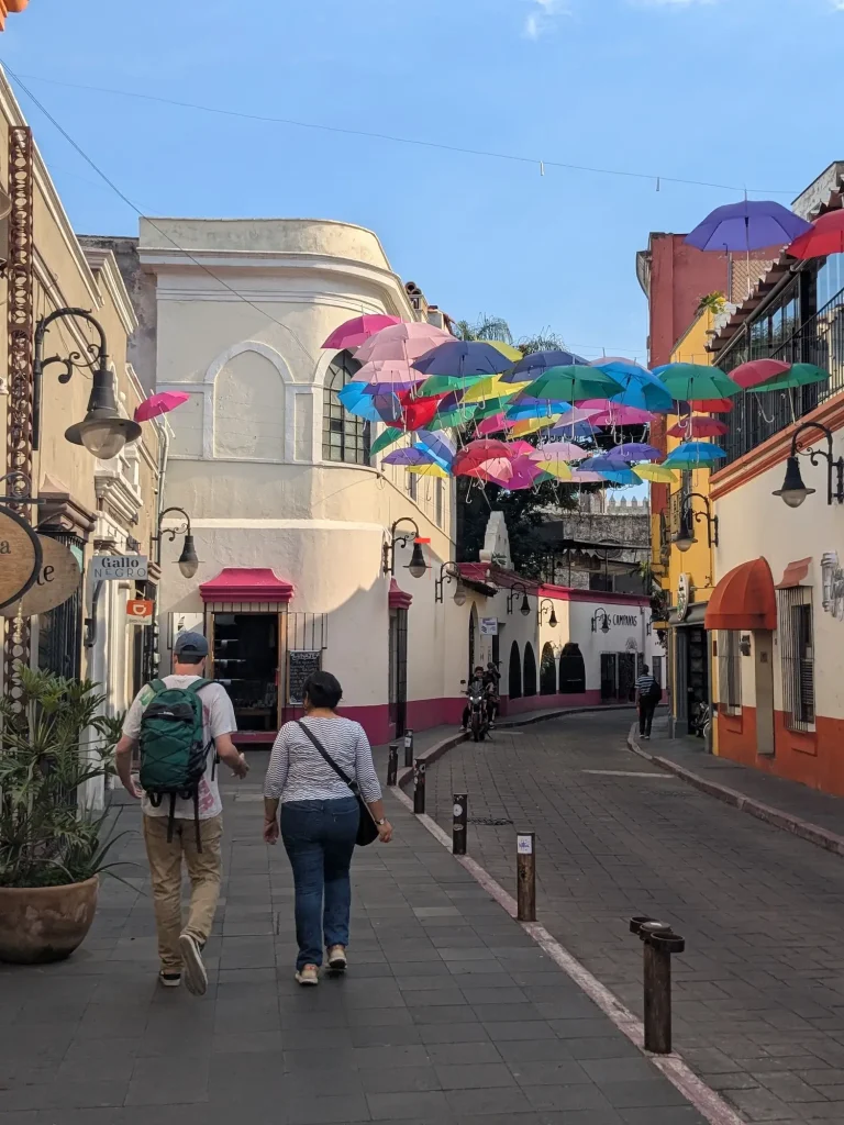 Two people walking down Calle Comonfort in Cuernavaca centre