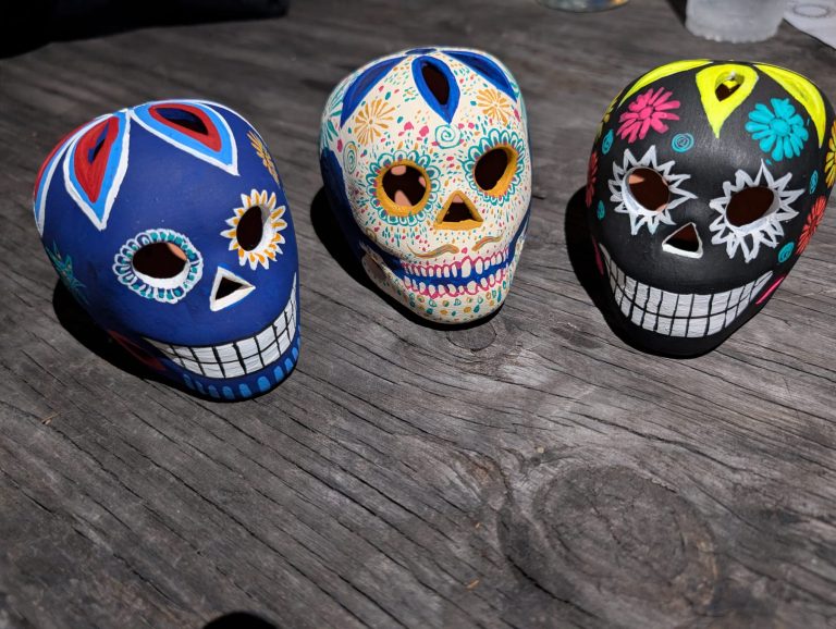 Ceramic Skulls painted by Spanish Immersion students during a Day of the Dead Skull Painting Workshop