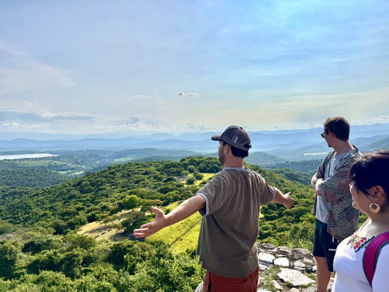 Spanish immersion students looking out over a beautiful view of south Morelos from the top of a pyramid in Xochicalco, Mexico