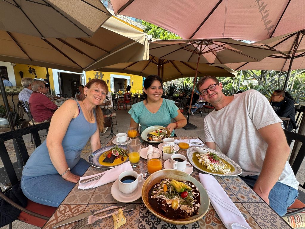 Spanish immersion students posing with their food in Mexico