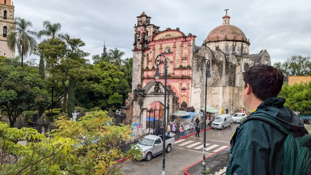Spanish immersion student looking towards the Cuernavaca Cathedral from the balcony of Casona Spencer in Cuernavaca Mexico